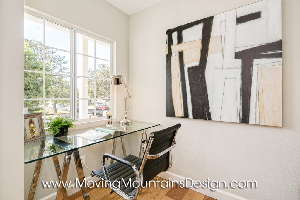 Office home staging with glass desk on chrome saw horses